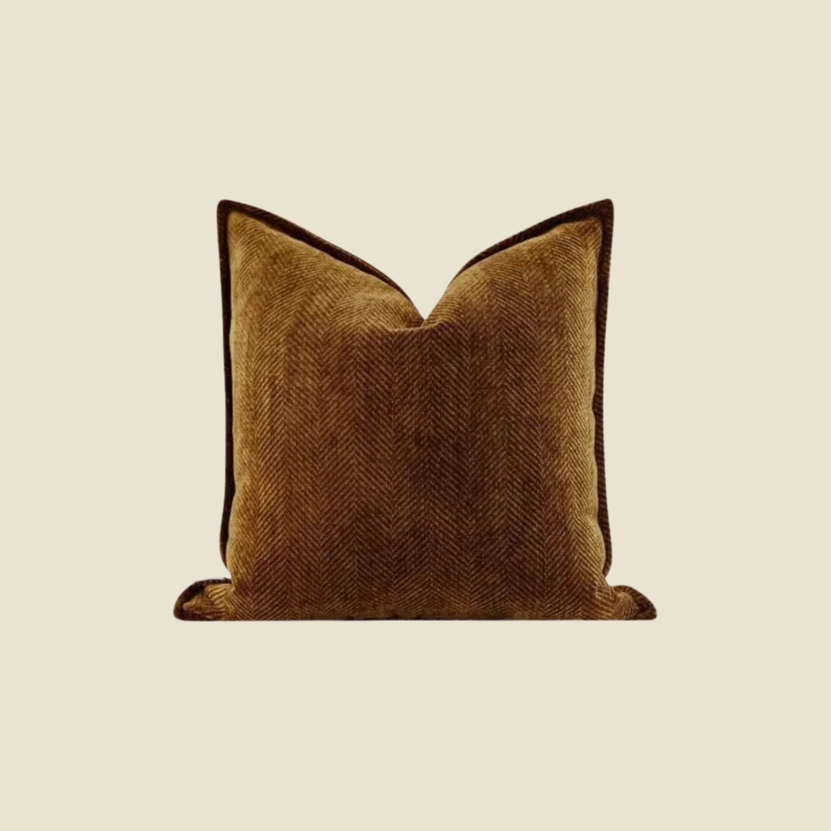 A square throw pillow in a warm brown herringbone fabric centered on a solid beige background.
