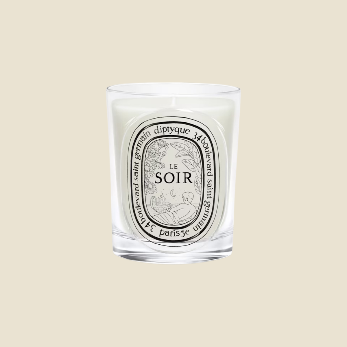 A Diptyque 'Le Soir' scented candle in a clear glass jar, centered against a solid beige background.