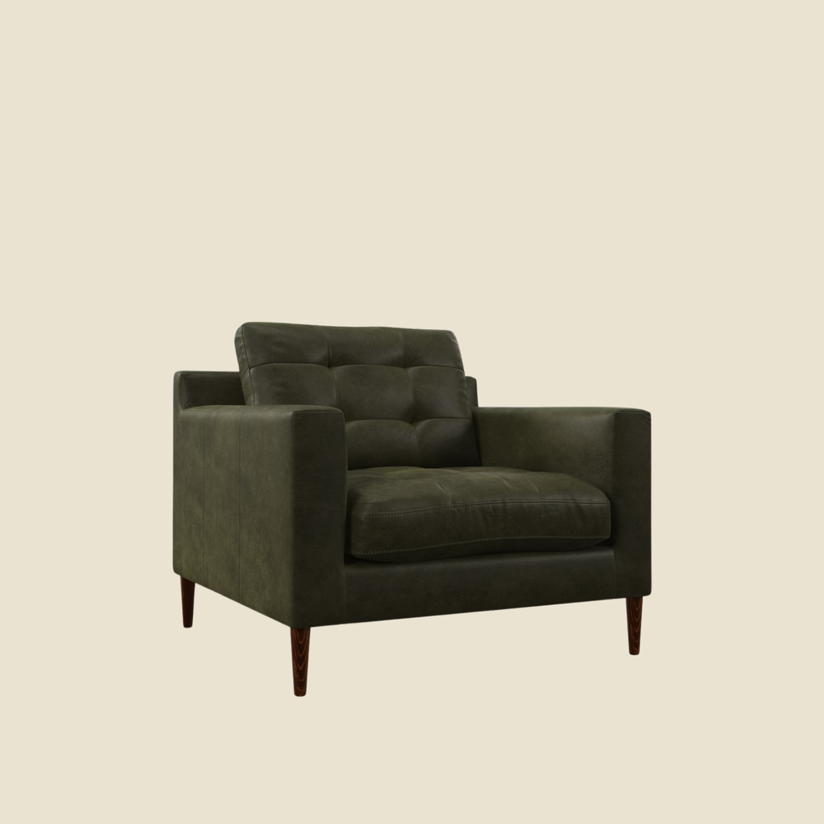 Green leather armchair on a beige background