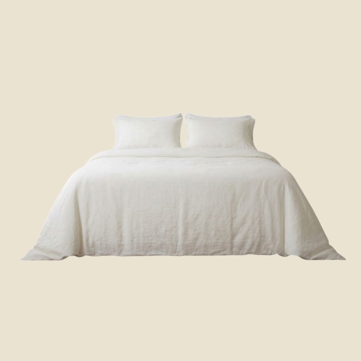 A neatly made bed with white bedding, including a duvet cover and two pillows, centered against a solid light beige background.