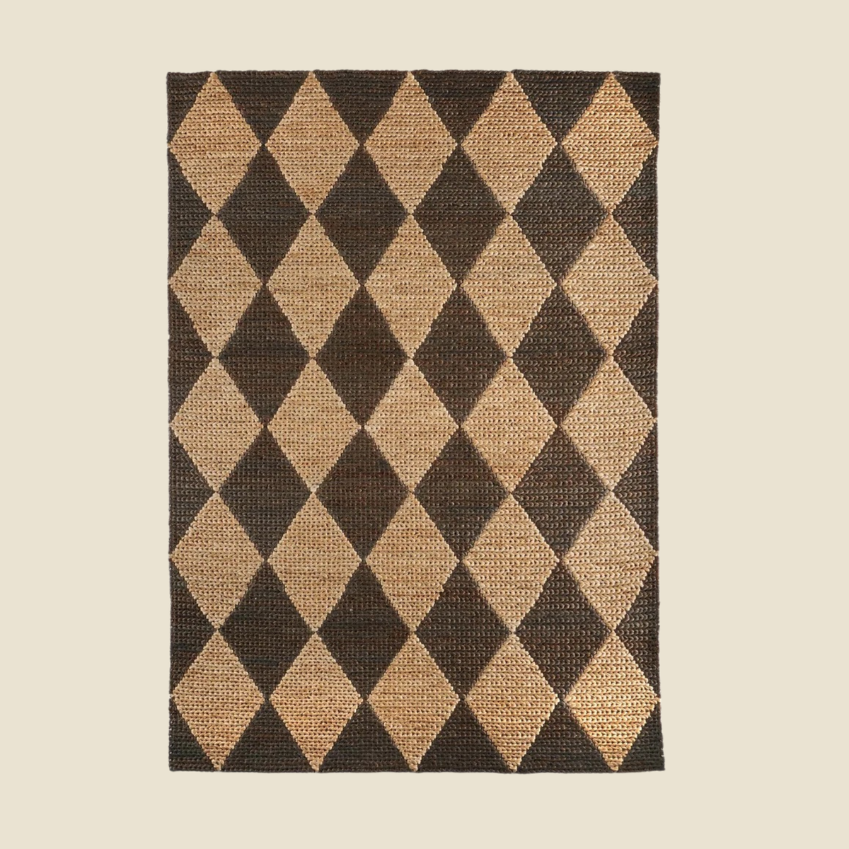 A rectangular woven rug with a dark brown and natural tan diamond harlequin pattern, shown flat against a solid light beige background.