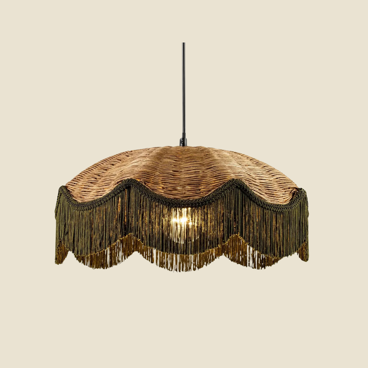 A woven wicker pendant light shade with a scalloped fringe trim, suspended by a black cord against a solid beige background.