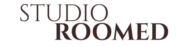 The text 'STUDIO ROOMED' in dark brown serif lettering on a solid white background.